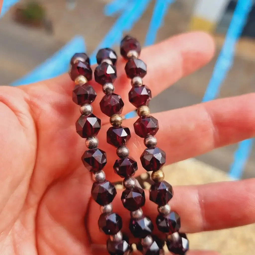 Antique silver modernist bracelet, floral motif and garnet glass beads.
